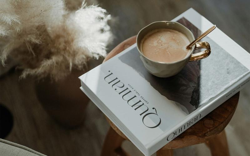 a cup of coffee on a book